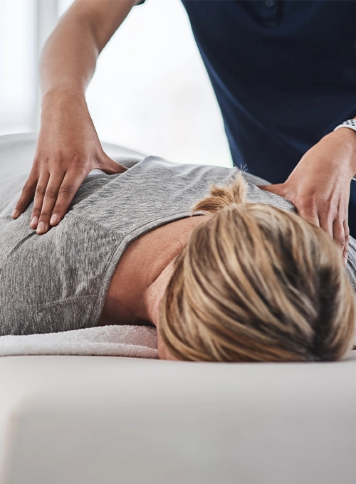 Chiropractic Puyallup WA Woman Receiving Adjustment